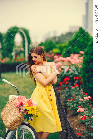 pretty girl with bicycle 48547790