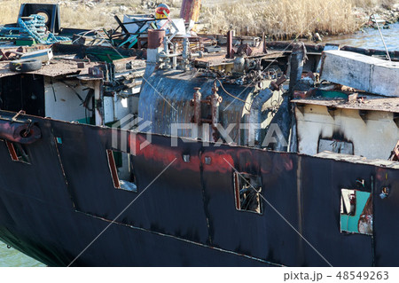 Part of the cargo ship in process of demolition Part of the cargo ship in process of demolition 48549263