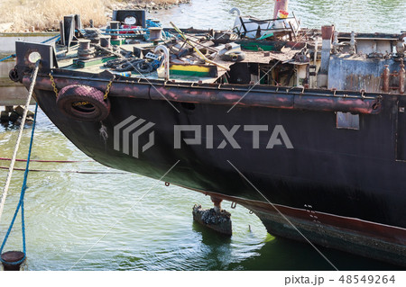 Aft part of cargo ship in process of demolition Aft part of cargo ship in process of demolition 48549264