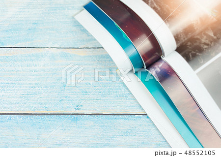 Stack magazines on wooden table 48552105