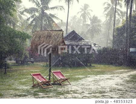 Heavy tropical rain and flooding in the area vacationing the village 48553325