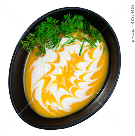 Cooked homemade tasty pumpkin and ginger cream soup in bowl Cooked homemade tasty pumpkin and ginger cream soup in bowl 48554465