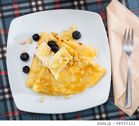 Pancakes with cheese brie and honey 48555121