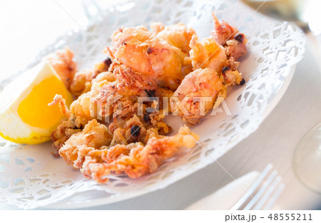 Chipirones, battered fried baby squid Chipirones, battered fried baby squid 48555211
