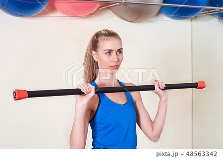 Female athlete doing sport exercise. Concept of health and body care. 48563342
