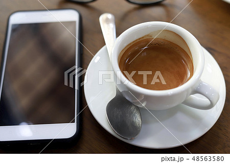 Hot coffee on wood background, black coffee. 48563580