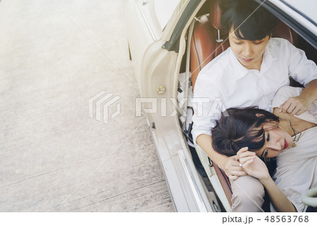 Portrait sweet couple loving in classic car. 48563768