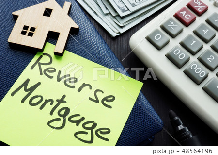 Reverse mortgage written on a memo stick. Reverse mortgage written on a memo stick. 48564196