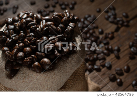 Coffee beans in a bag, closeup 48564789