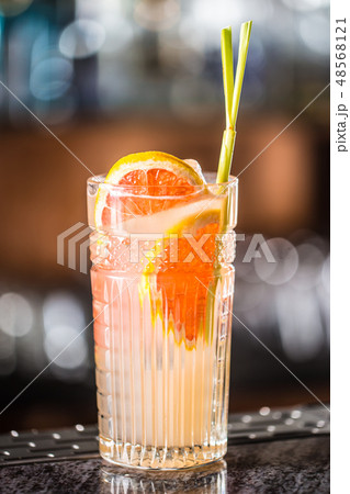 Paloma cocktail tequila drink with grapefruit at barcounter in night club or restaurant 48568121
