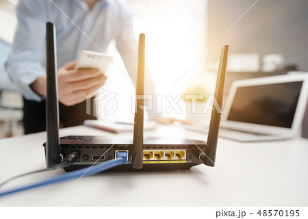 Wireless router concept. Man using smartphone 48570195