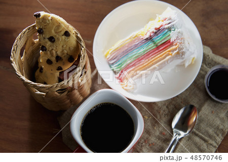 coffee cup with cupcake and chocolate cookie 48570746