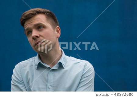 Sad man looking away. 48572680