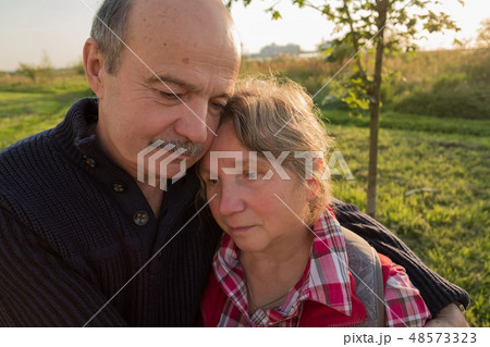 Sad elderly couple. Coping with problems together. 48573323