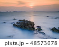 Beautiful rocky sea beach at the sunset 48573678