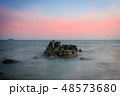 Beautiful rocky sea beach at the sunset 48573680