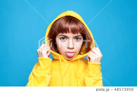 フードを被った女性の写真素材