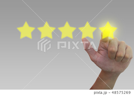 Hand pushing on five stars for best rating. 48575269