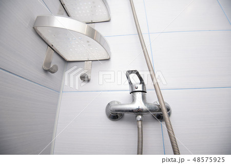 Close up part of used stainless steel shower in bathroom 48575925