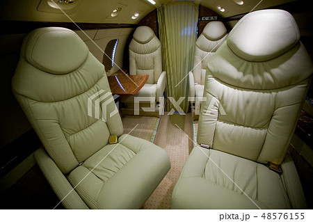 Luxury interior in bright colors of genuine leather in the business jet 48576155