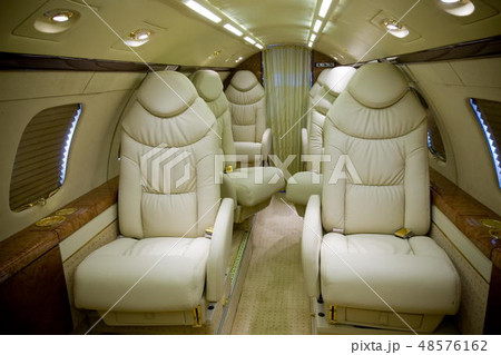 Luxury interior in bright colors of genuine leather in the business jet Luxury interior in bright colors of genuine leather in the business jet 48576162