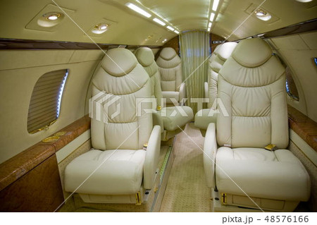 Luxury interior in bright colors of genuine leather in the business jet Luxury interior in bright colors of genuine leather in the business jet 48576166
