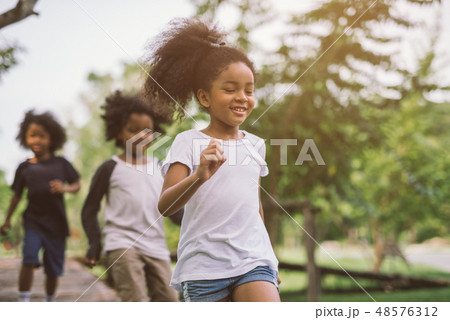 kids playing outdoors kids playing outdoors 48576312