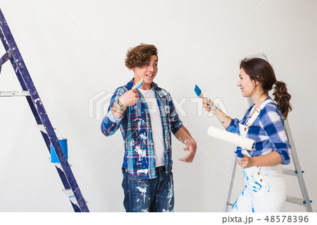 Conflict, repair and renovation concept - Young woman and man with annoying faces and bad emotions Conflict, repair and renovation concept - Young woman and man with annoying faces and bad emotions 48578396