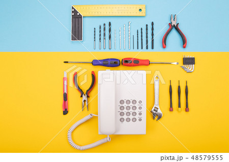 set of metalwork tools with phone on colorful background 48579555