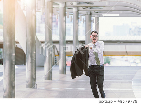 businessman in a hurry and running, he is late 48579779