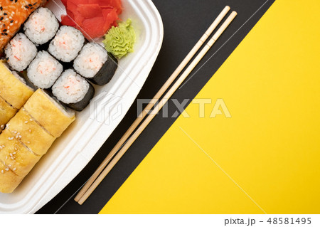 Top view on sushi set at colored background. Top view on sushi set at colored background. 48581495