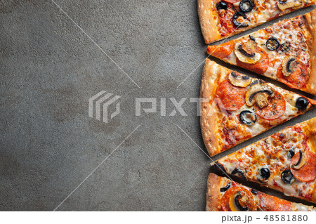 Slices of pepperoni pizza with mushrooms. Slices of pepperoni pizza with mushrooms. 48581880