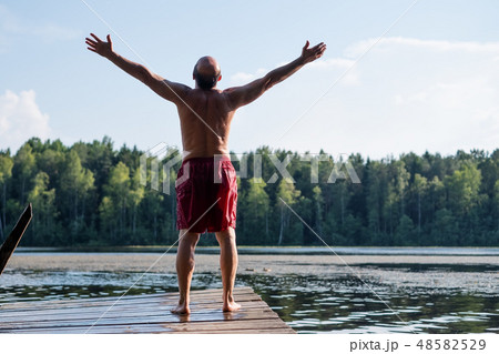 Man standing on a lake 48582529