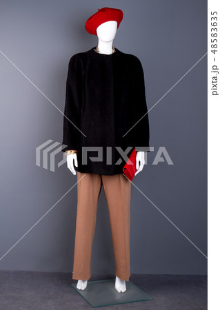 Female mannequin with red beret and wallet. Female mannequin with red beret and wallet. 48583635
