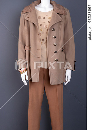 Female fashionable autumn overcoat. 48583667
