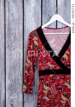 Female clothing hanging on hanger. 48583721