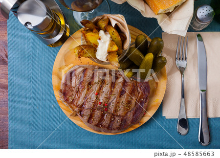 Grilled beef with fried potatoes Grilled beef with fried potatoes 48585663