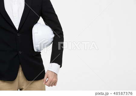 Portrait of engineer, helmet in his arm.. Portrait of engineer, helmet in his arm.. 48587376