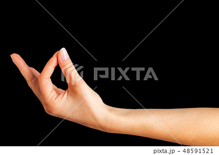 Woman hand holding something with two fingers Woman hand holding something with two fingers 48591521