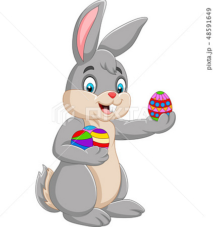 Easter Bunny holding a decorated an egg Easter Bunny holding a decorated an egg 48591649