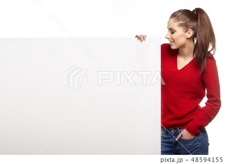Beautiful young woman with white blank board Beautiful young woman with white blank board 48594155