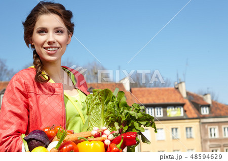 Pretty spring woman with bicycle and groceries in old town stree Pretty spring woman with bicycle and groceries in old town stree 48594629