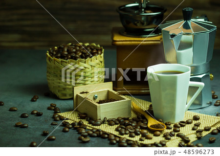 Brew black coffee in white cup and morning light. 48596273