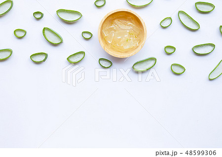 Aloe vera slices with gel in wooden bowl  48599306