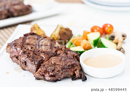 Serving portion of grilled wagyu beef steak Serving portion of grilled wagyu beef steak 48599445