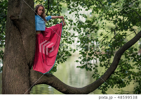 woman standing in yoga balance woman standing in yoga balance 48599538