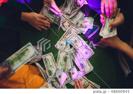 paper money in female hands on green background. paper money in female hands on green background. 48600945