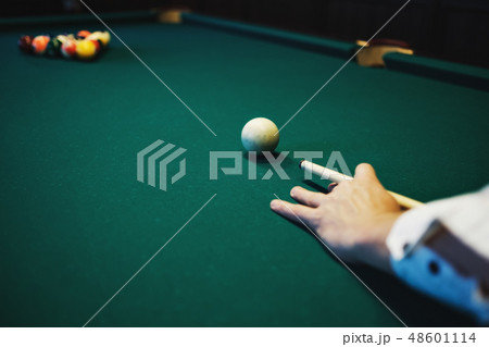 Man playing billiard, snooker.  48601114
