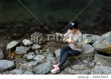 Asian woman eat salad 48603904