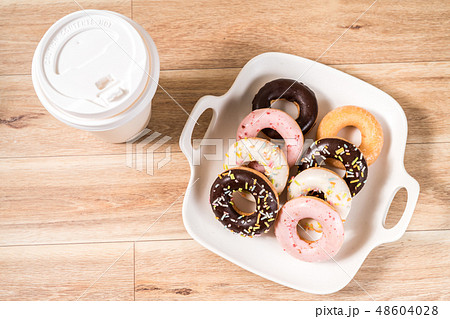 Donuts and coffee on wooden table.甜甜圈,甜點,點心,下午茶 Donuts and coffee on wooden table.甜甜圈,甜點,點心,下午茶 48604028